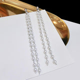 Orecchini lunghi mini perle perle